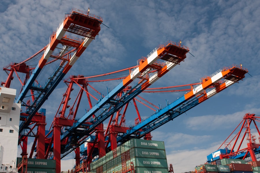 Red and blue cranes under blue sky